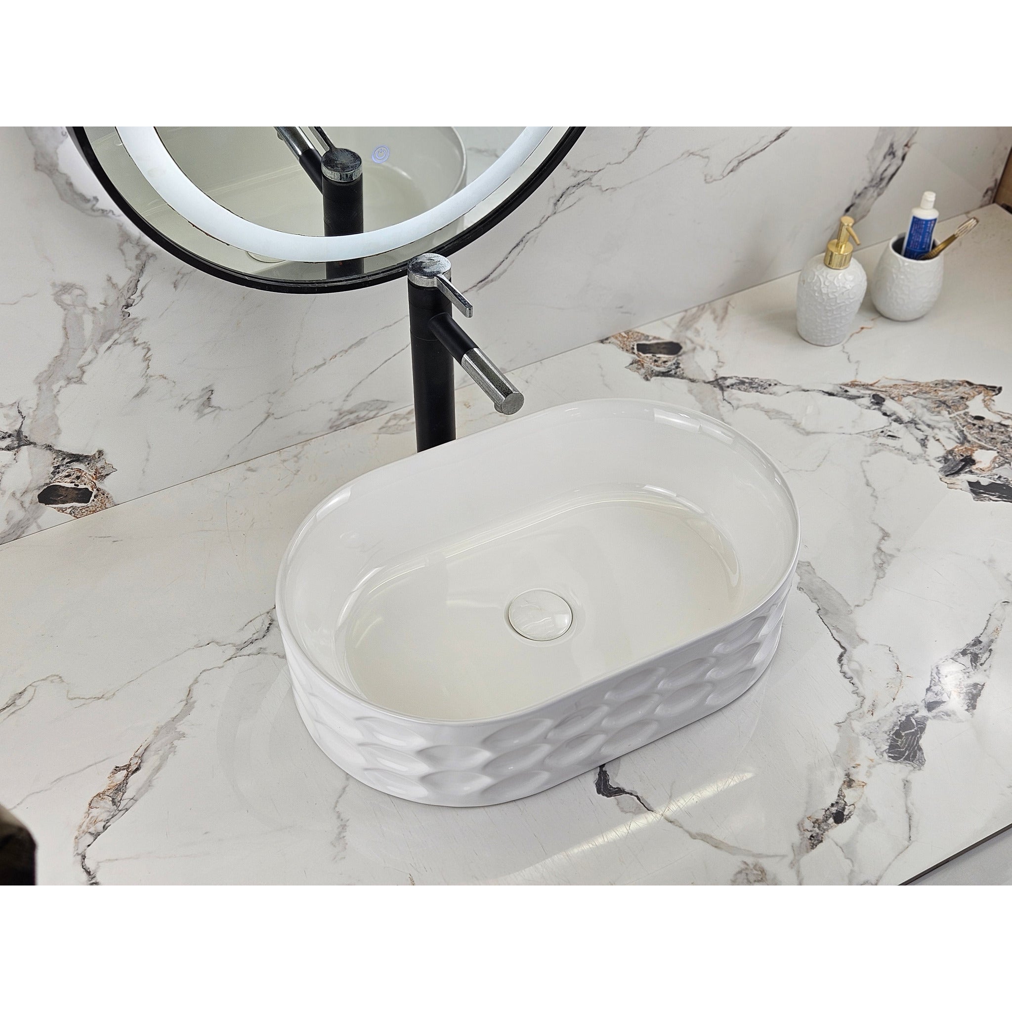 Infinity IA103 oval textured gloss white basin with black tapware, left angled view