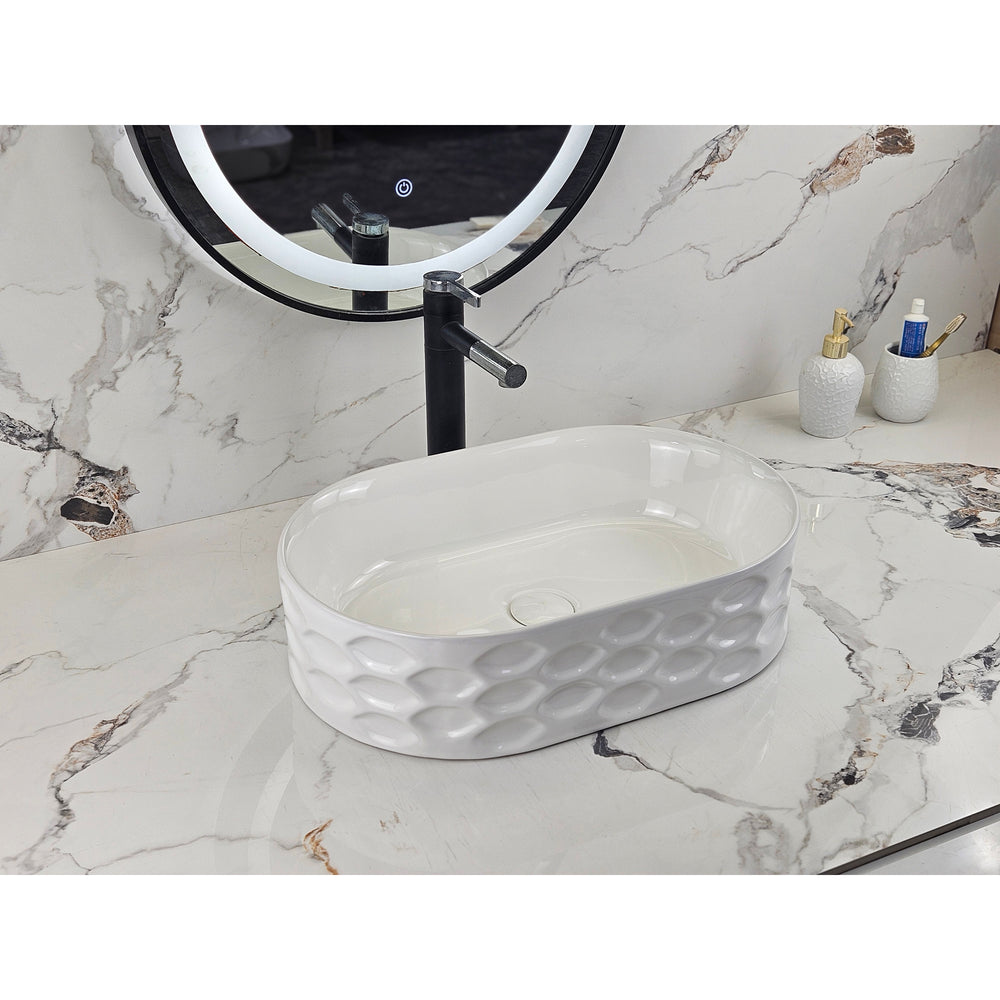 Infinity IA103 oval textured gloss white basin with black tapware, front angled view