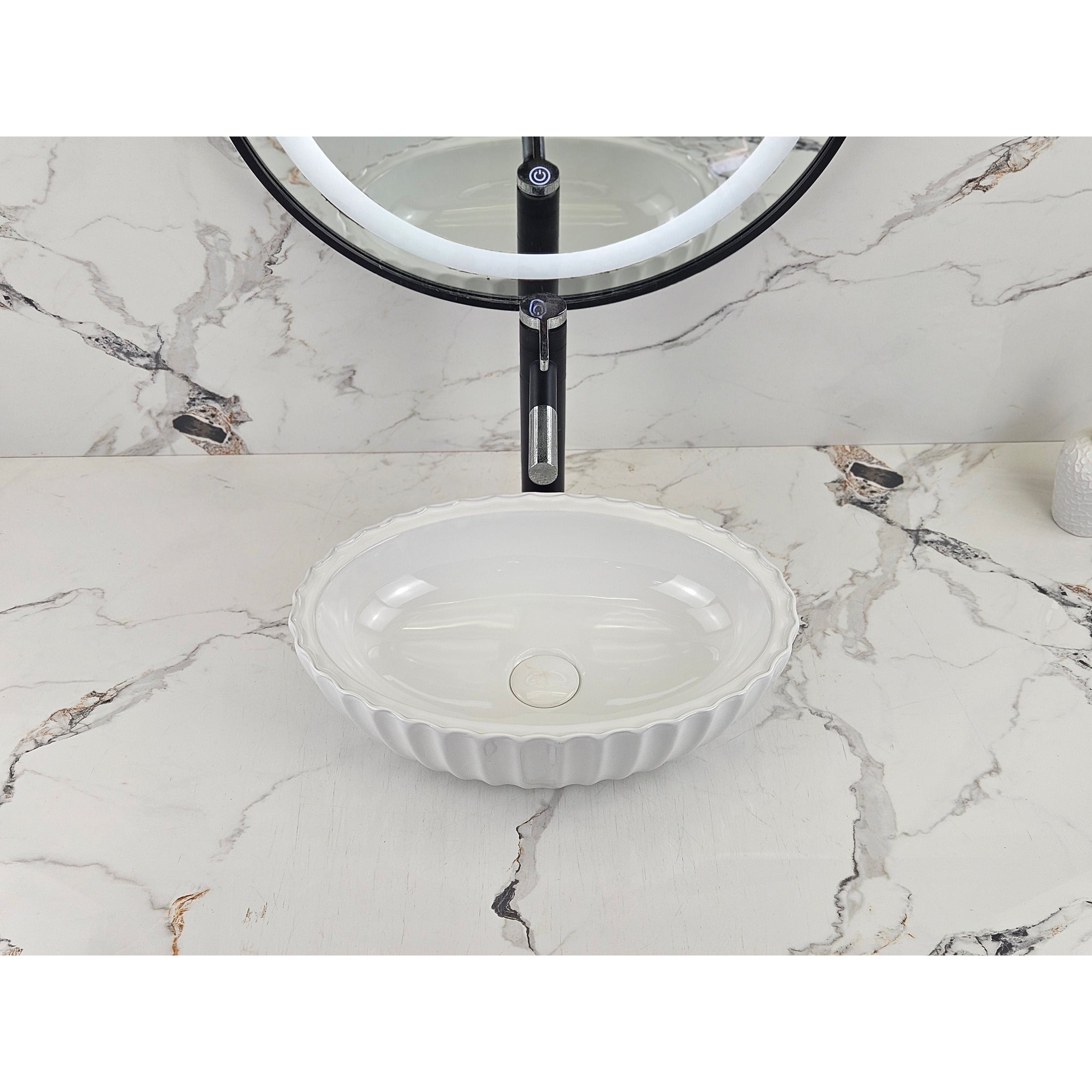 Infinity IA102 oval fluted gloss white basin shown front-on with black tapware